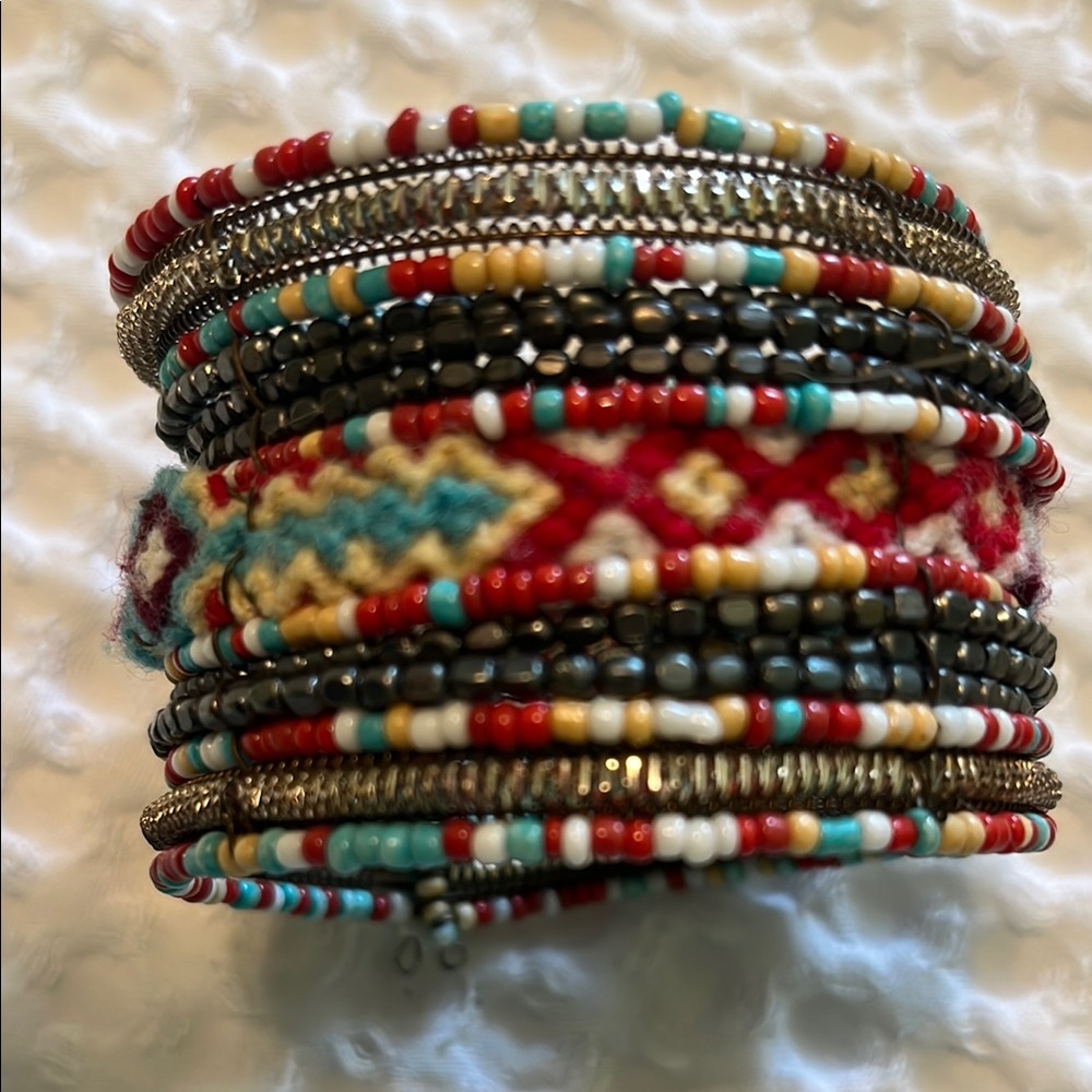 Tribal wrist cuff (I have big wrists) Stretchy.
Combo of beads and stitch work.